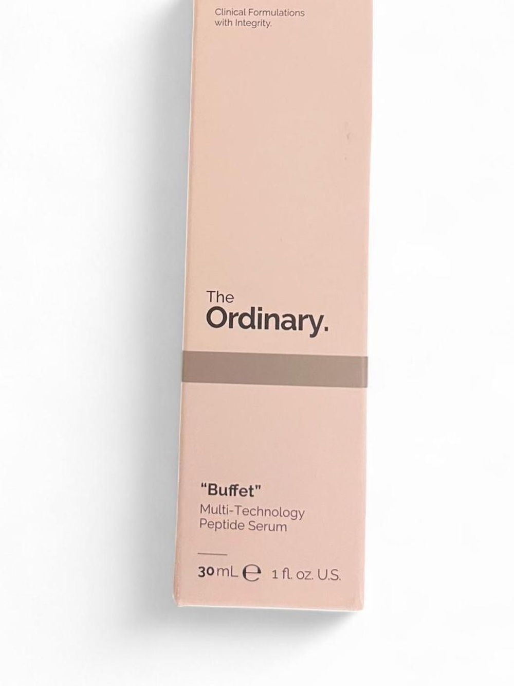 The Ordinary pale pink retail box — minimalist skincare packaging